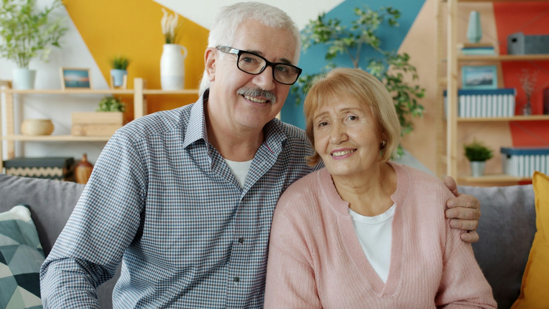 An older couple relaxed and at ease together at home